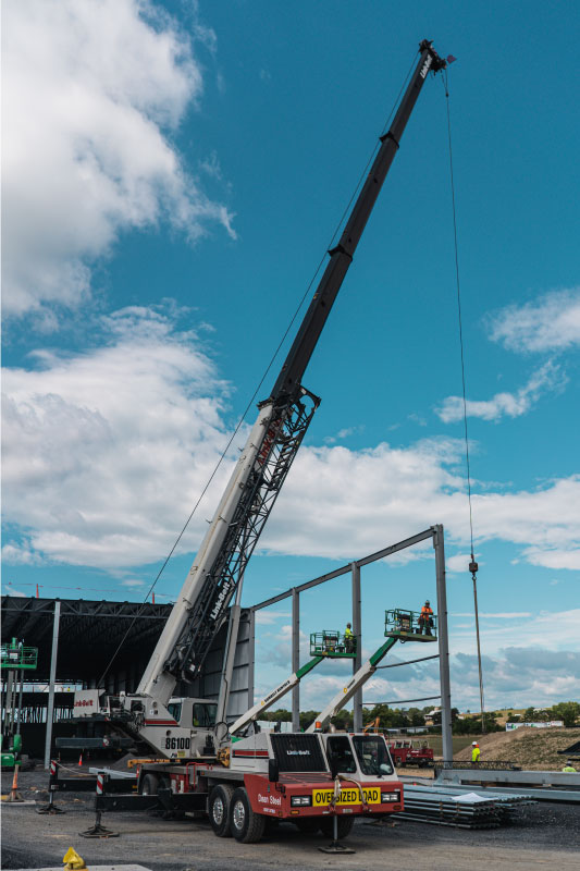 Dean Steel crane and crew at a job site
